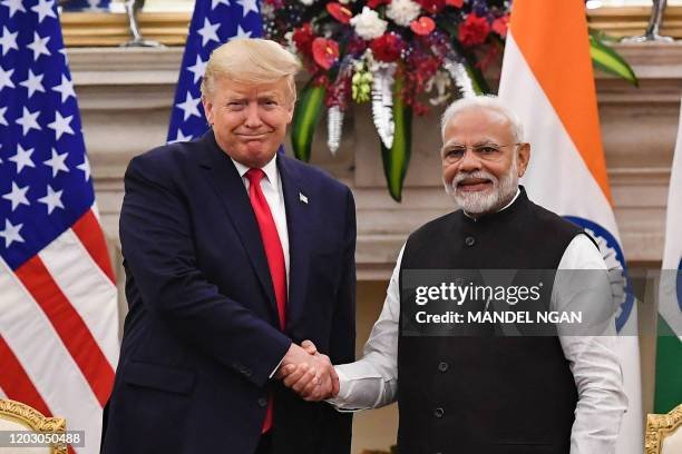 India's Prime Minister Narendra Modi (R) shakes hands with US President Donald Trump before a meeting at Hyderabad House in New Delhi on February 25, 2020. (Photo by Mandel NGAN / AFP) (Photo by MANDEL NGAN/AFP via Getty Images)
