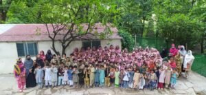 The Students And Teachers Of Qadir Nagar High School IN Pakistan Pose For A Picture